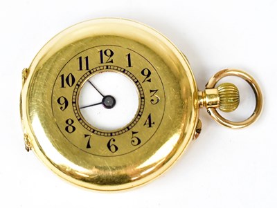 Lot 1149 - An 18k yellow gold half hunter crown wind...