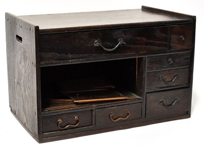 Lot 194 - A Japanese small tabletop tansu comprising...