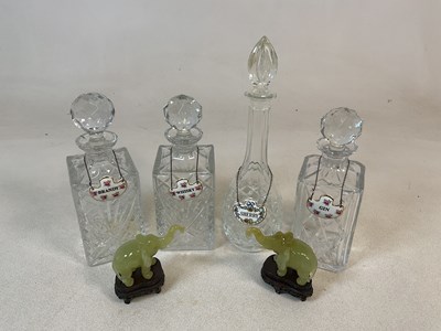 Lot 448 - Four glass decanters, tallest 34cm, and has a...