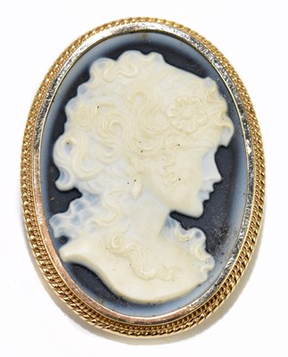 Lot 507 - A 9ct yellow gold and laser cut hardstone...
