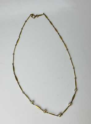 Lot 853 - A yellow metal and pearl chain, length 38.5cm,...