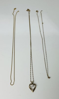 Lot 859 - Two 9ct gold chains and a Middle Eastern...
