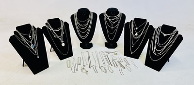 Lot 972 - A collection of silver and white metal chains.