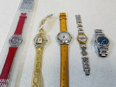 Lot 1116 - SWATCH; a 'Skin' watch in case and four other...