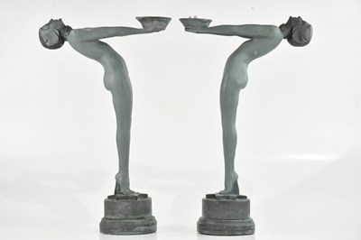 Lot 412 - A pair of Art Deco style plaster candle...