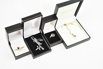 Lot 532 - A 9ct white gold cross pendant set with...