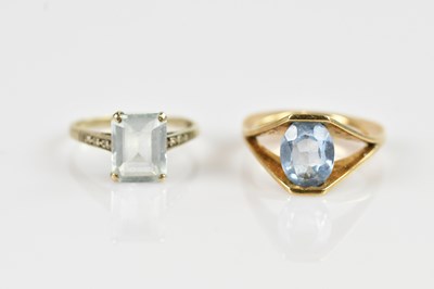 Lot 2553 - A white metal dress ring, set with a pale blue...