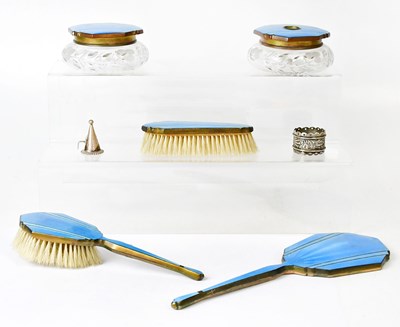 Lot 256 - An Art Deco blue enamelled dressing table set,...