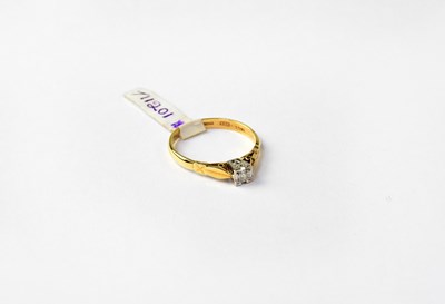 Lot 999 - An 18ct gold solitaire diamond ring, stamped...