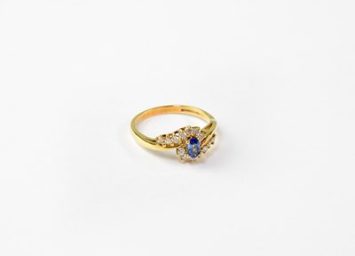 Lot 1020 - An 18ct gold ring set with sapphire and...