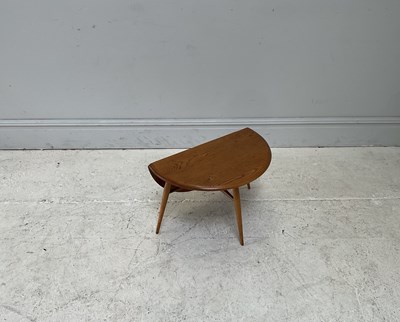 Lot 19 - IN THE MANNER OF ERCOL; a small elm drop-leaf...