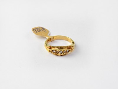 Lot 1022 - An 18ct gold ring set with five graduated...