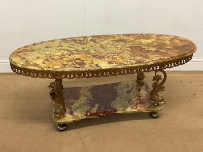 Lot 2855 - An onyx and gilt over brass Hollywood Regency...