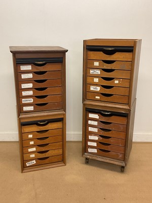 Lot 2856 - Four wooden stackable drawer units with black...