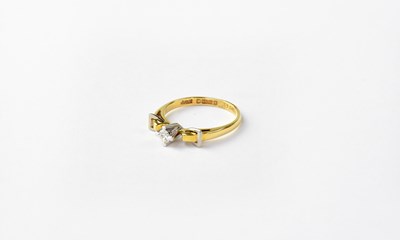 Lot 1000 - An 18ct gold solitaire diamond ring in a...