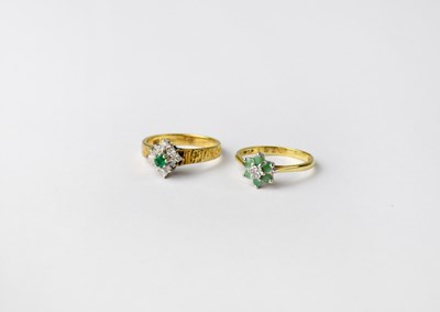 Lot 1031 - Two 18ct gold emerald and diamond cluster...