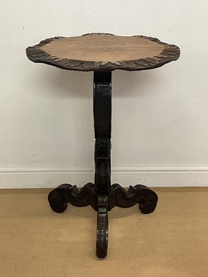Lot 2842 - A carved oak pedestal table with carved...