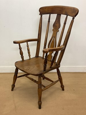 Lot 2860 - An elm stick back open armchair with turned...