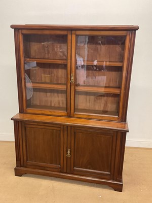 Lot 2832 - An Edwardian glazed bookcase with cupboard...