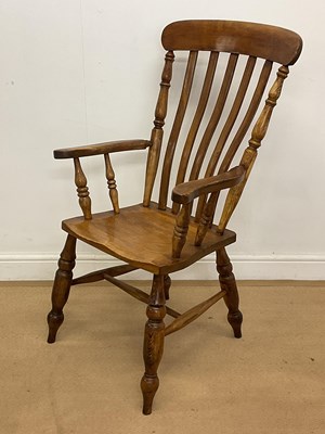 Lot 2866 - An oak Windsor slatback armchair, height 105cm.