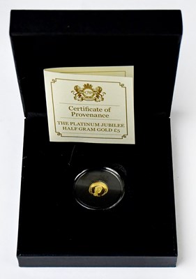 Lot 981 - A 2022 Jersey 1/2g gold £5 coin for the...