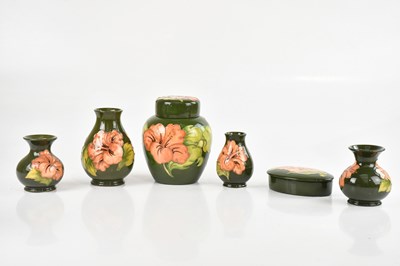 Lot 1553 - MOORCROFT; a collection of 'Hibiscus' pattern,...