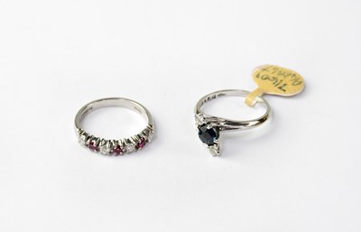 Lot 1027 - Two 18ct white gold rings, one set with...