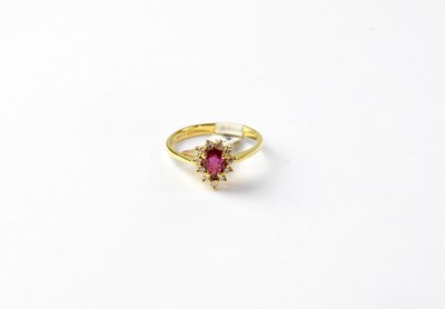 Lot 1010 - An 18ct gold cluster ring set with pear cut...