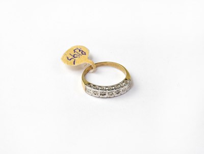 Lot 1059 - A 9ct gold ring set with seven diamonds in...