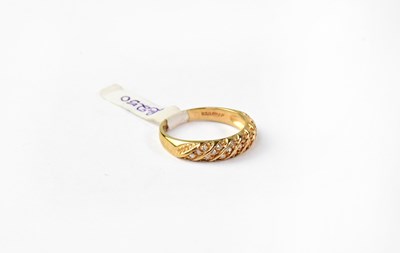 Lot 1061 - A 9ct gold ring set with eight bands of three...