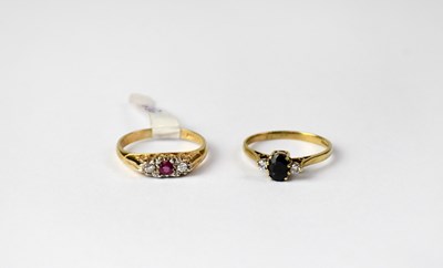 Lot 1090 - Two 9ct gold rings, one set with ruby and a...