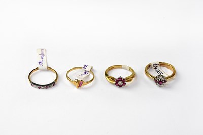 Lot 1101 - Four 9ct gold rings variously set with rubies...