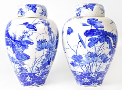 Lot 224 - A pair of blue and white ginger jars,...