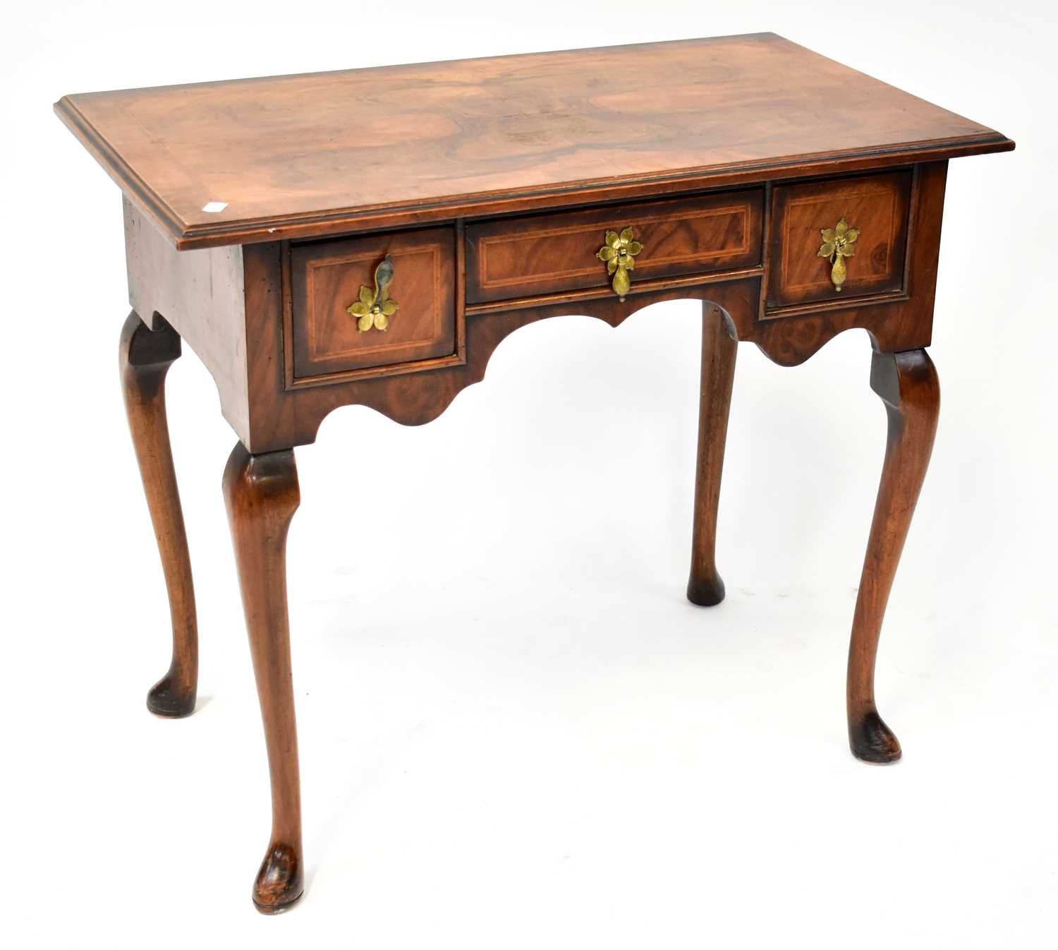 Lot 20 - A reproduction walnut and mahogany lowboy, the...