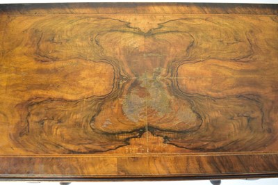 Lot 20 - A reproduction walnut and mahogany lowboy, the...