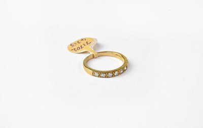 Lot 1063 - A 9ct gold half eternity ring with seven...