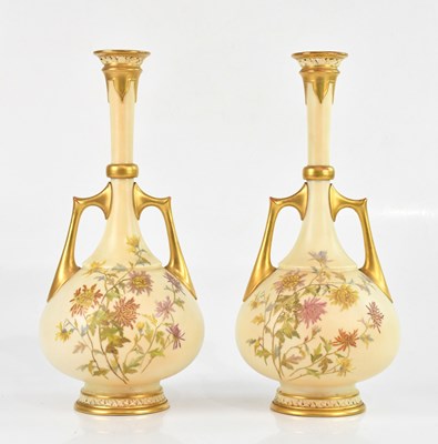 Lot 1851 - ROYAL WORCESTER; a large pair of twin handled...