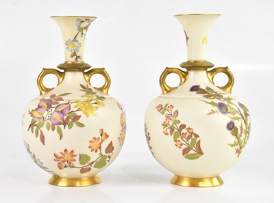 Lot 1854 - ROYAL WORCESTER; a near pair of twin handled...