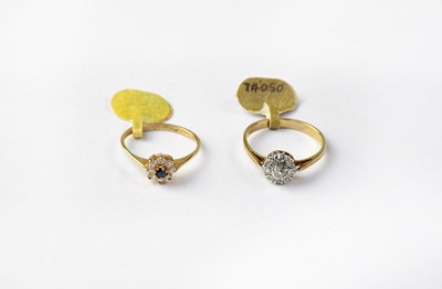 Lot 1085 - Two 9ct gold cluster rings, one set with...