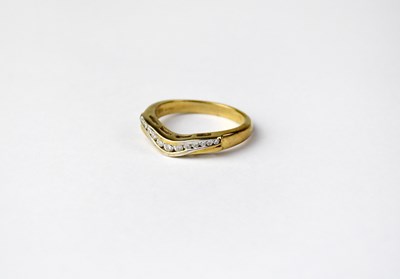 Lot 1058 - A 9ct gold wishbone-shaped ring set with...