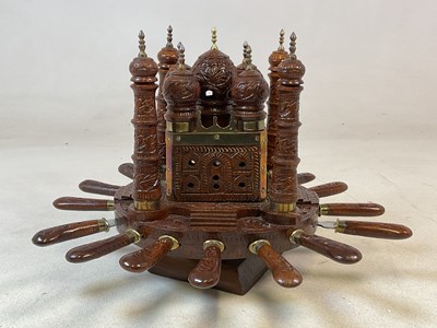 Lot 155 - An unusual carved wooden rotating set of six...