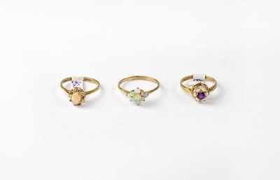 Lot 1100 - Three 9ct gold cluster rings, one set with...