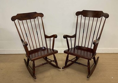 Lot 2835 - A pair of mahogany rocking chairs, height 102cm.