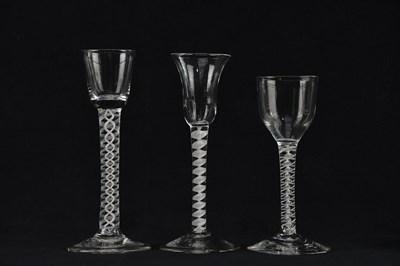 Lot 1769 - Three 19th century air twist wine glasses...