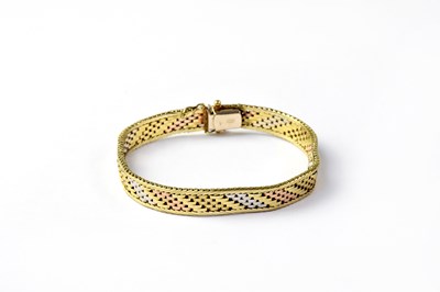Lot 1111 - A 9ct gold flat link bracelet with white, rose...