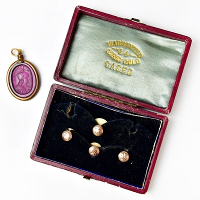 Lot 1095 - An amethyst-coloured glass intaglio pendant of...