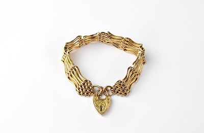 Lot 1114 - A 9ct gold five bar gate bracelet, stamped 9,...