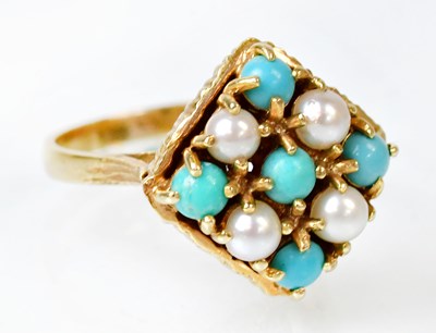 Lot 1073 - A 9ct yellow gold ring set with four seed...