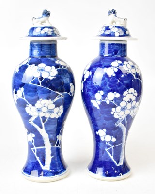 Lot 146 - A pair of Chinese blue and white lidded vases,...