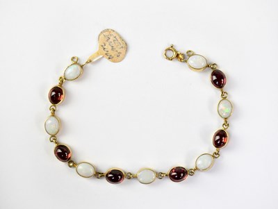 Lot 1120 - A 9ct gold bracelet set with alternating...
